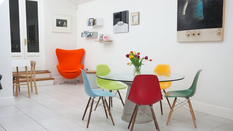 Carol Anne replaced her long dining table with a more space-friendly round table and colourful chairs
