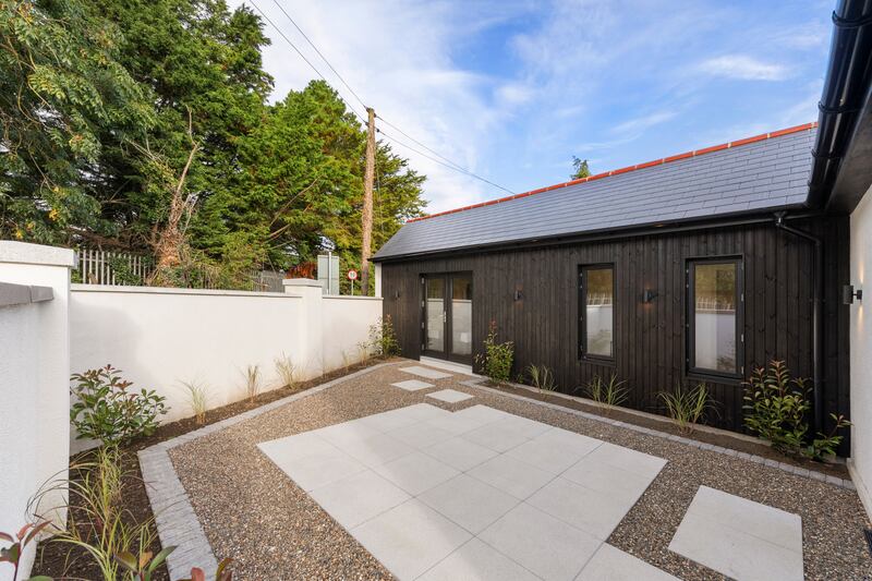 A patio is accessed from the kitchen and main bedroom