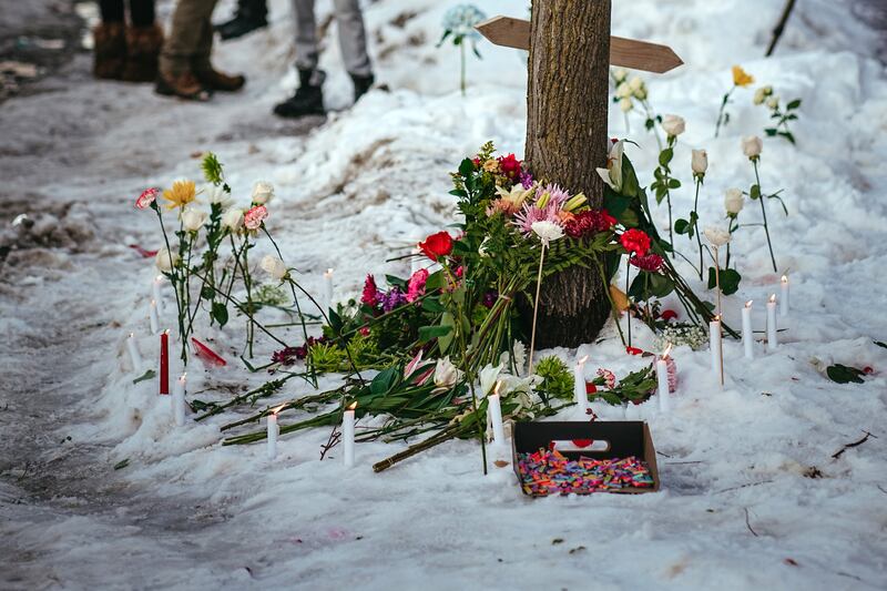 Candles, flowers are left at a makeshift memorial near the site of a shooting where a federal officer shot and killed a 37-year-old woman in Minneapolis, on Wednesday, Jan. 7, 2026. Photograph: Jamie Kelter Davis/The New York Times
                      