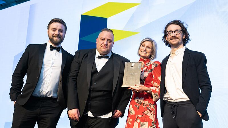 Carl Asutaitis, group commercial manager, CLG Group, presents the Fit Out Design Practice of the Year award to TapCreative. team.