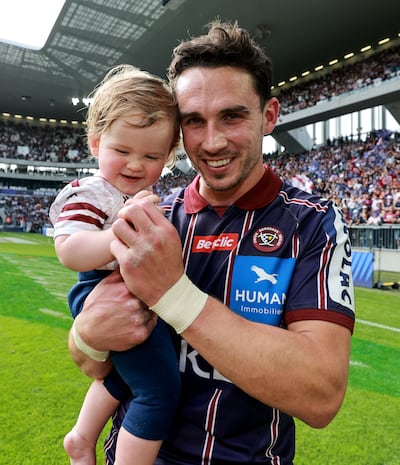 A delighted Joey Carbery with his son after his side, Bordeaux Bègles, beat Toulouse in the Champions Cup semi–final. Photograph: Dan Sheridan/Inpho