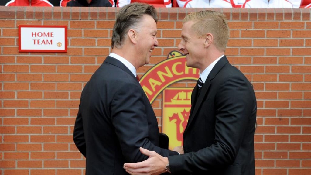 Manchester United manager Louis van Gaal and Swansea City manager Gary Monk, during the Barclays Premier League match at Old Trafford. Monk has signed Federico Fernandez from Napoli. Photograph: Martin Rickett/PA Wire.