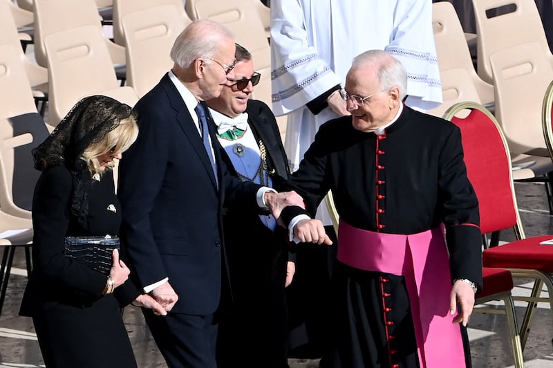 Former US President Joe Biden and former First Lady Jill Biden are greeted by members of the clergy as they arrive for lthe funeral ceremony, Photograph: Isabella BONOTTO / AFP