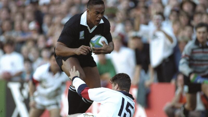 Jonah Lomu runs through England fullback Mike Catt on the way to scoring a try during the 1995 Rugby World Cup semi-final in Cape Town. Photograph:   Ben Radford /Allsport