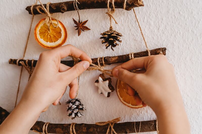 You can repurpose the things you already have, such as using ribbons to stream bobbles together and make garlands for your hallway or around the house.