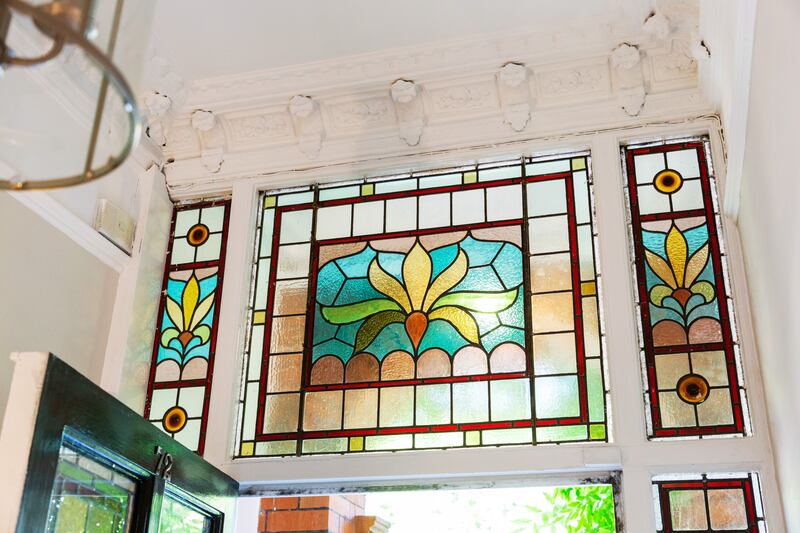 Stained glass panes above the front door