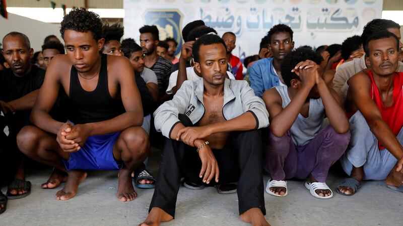 Migrants in a shelter who were relocated from government-run detention centres after being trapped by clashes between rival groups in Tripoli, Libya. Photograph: Hani Amara/Reuters