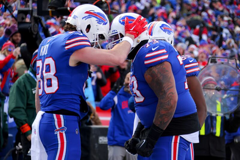 Dawson Knox (88) of the Buffalo Bills celebrates with Dion Dawkins (73) after scoring a touchdown  against the Miami Dolphins. Photograph: Timothy T Ludwig/Getty Images