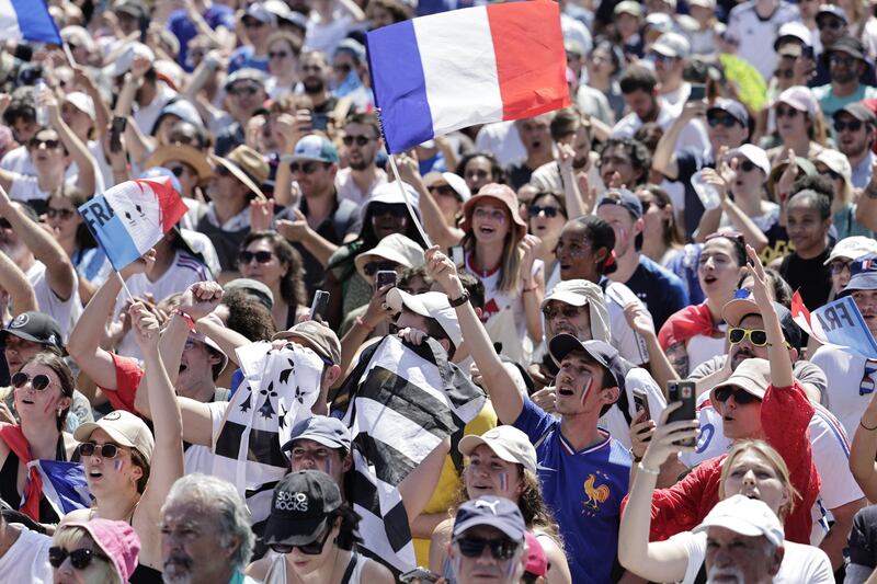 Supporters watching the men's volleyball gold medal match in Paris between France and Poland. Photograph: Stephane de Sakutin/AFP