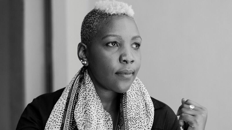 Anyango Mpinga wearing one of her silk scarves with scarifcation motifs. Photograph: Fionn McCann