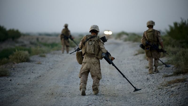 US Marines in 2009 sweep the road for Improvised Explosive Devices (IED’s) in Garmsir district of Helmand Province, Afghanistan. Photograph: Manpreet Romana/ AFP via Getty Images