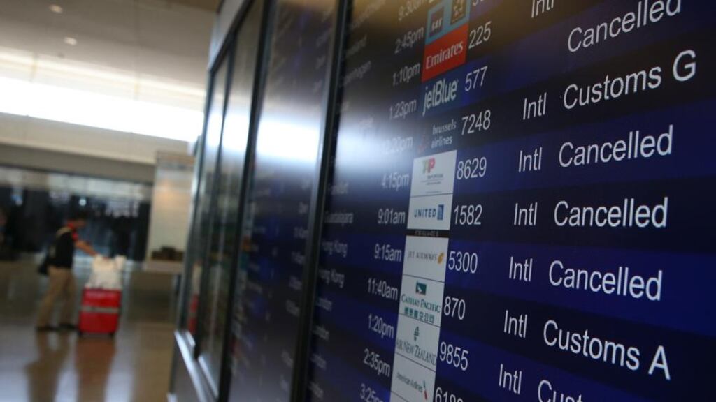 A display shows several cancelled flights in the international terminal at San Francisco International Airport in California yesterday. Photograph: Justin Sullivan/Getty Images