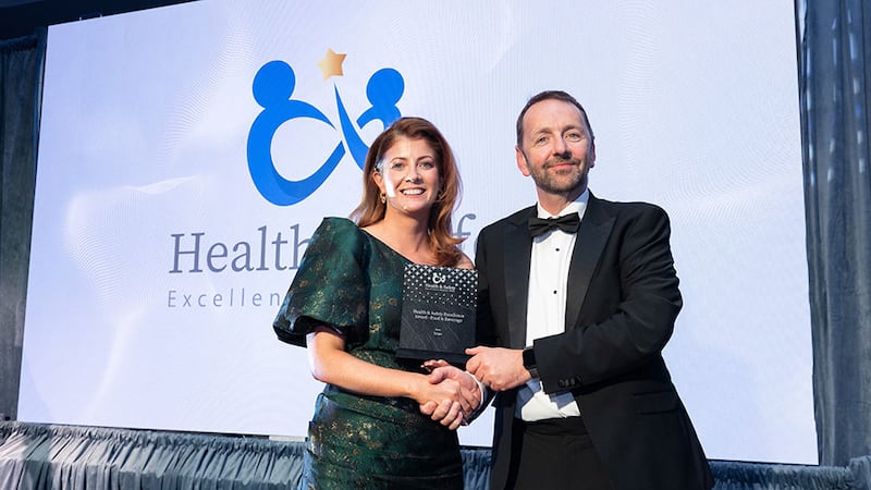 Sandra McGourty, awards judge, presents the health & safety excellence - food & beverage award to Larry McDonald, Tirlán