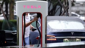 Tesla cuts China car prices to absorb hit from trade war tariffs