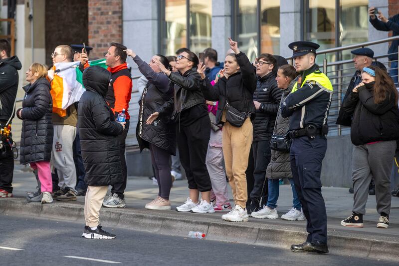 A group of about 30 people gathered outside the International Protection Office on Dublin’s Mount Street on Friday evening to protest at what they described as a migrant camp on their doorstep. Photograph: Tom Honan