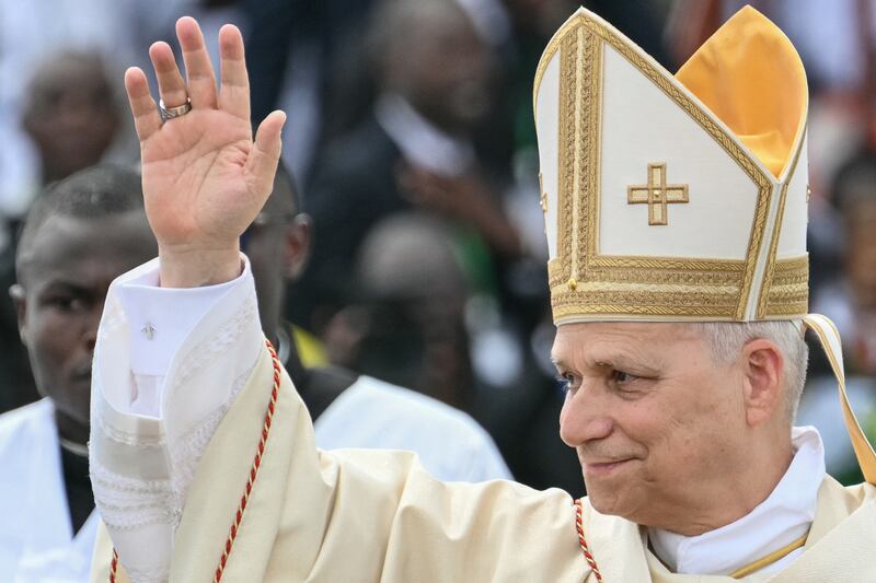 Pope Leo XIV waves to the crowd on Friday as he arrives to lead the Holy Mass at the area in front of Japoma Stadium in Douala on the fifth day of an 11-day apostolic journey to Africa. Photograph: Alberto Pizzoli/AFP via Getty Images