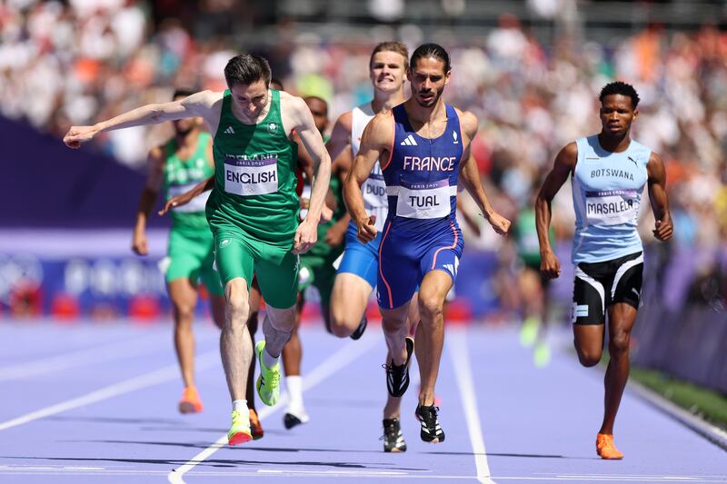 Ireland's Mark English crosses the line alongside France's Gabriel Tual in the men's 800m round one at Stade de France in Paris. Photograph: Hannah Peters/Getty