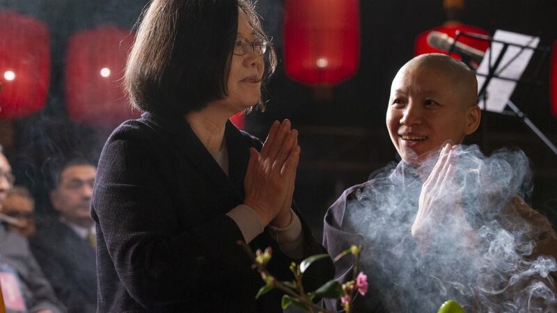 Taiwan’s president Tsai Ing-wen (left) praying for peace at the Dharma Drum Mountain in New Taipei City, Taiwan on Monday. Photograph: Taiwan presidential office  handout/EPA