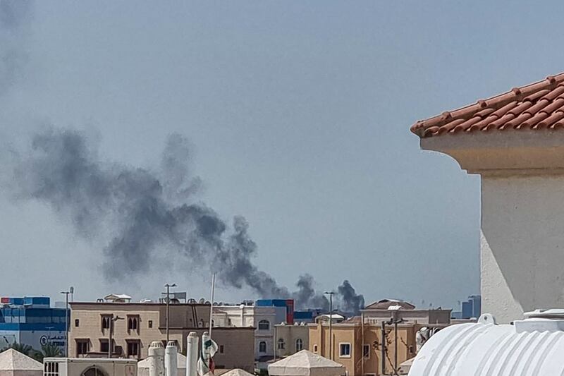 A smoke plume rises over Abu Dhabi from the site of an Iranian missile strike on Saturday. Photograph: AFP via Getty Images