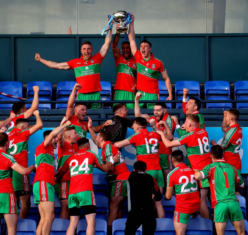 Dublin stars Paddy Small, James McCarthy and John Small lift the Dublin SFC title at Parnell Park in 2020.  Photograph: Ryan Byrne/Inpho 
