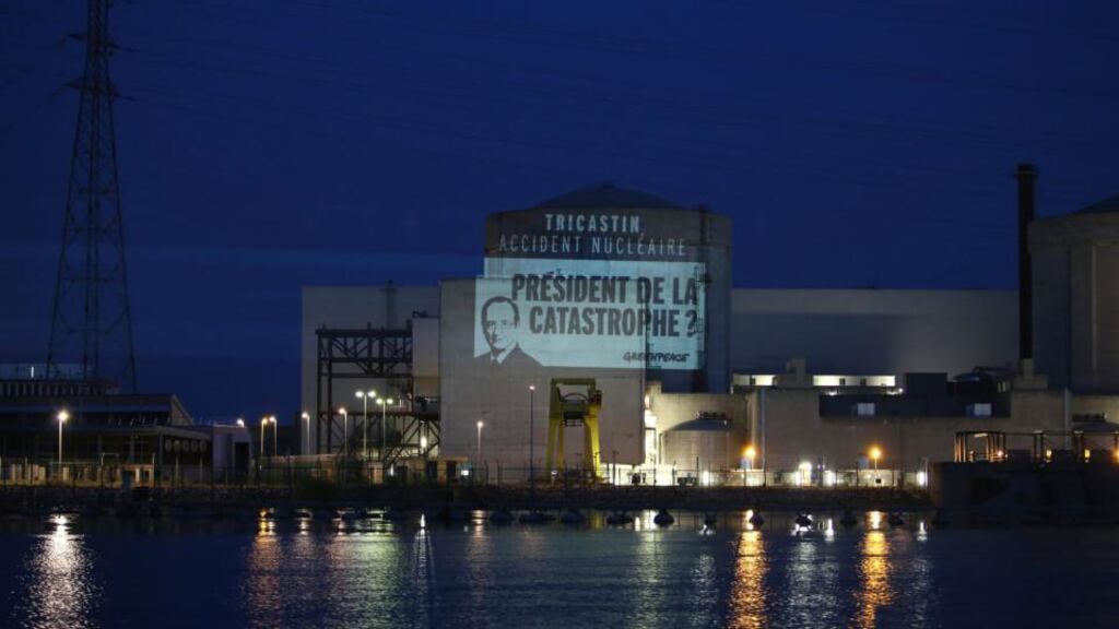 A banner showing a picture of French president Francois Hollande displayed by Greenpeace activists is seen at the Areva nuclear power plant site in Tricastin, southern France. Over 20 Greenpeace activists climbed fences to break into an EDF nuclear power plant in southern France this morning and demanded its closure, the environmental campaign group said. The activists, dressed in red, broke into the Tricastin plant at dusk and unfurled a yellow and black banner on the wall saying above a picture of President Francois Hollande: “Tricastin, nuclear accident - President of the catastrophe?” Photograph: Greenpeace/Reuters