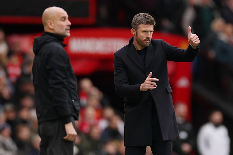 Manchester City head coach Pep Guardiola (left) and Manchester United interim head coach Michael Carrick on the touchline during the game at Old Trafford. Photograph: Carl Recine/Getty Images