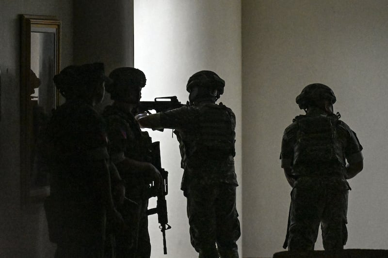 Philippine troops exchange gunshots inside the senate of the Philippines. Photograph: Jam Sta Rosa/AFP/Getty Images