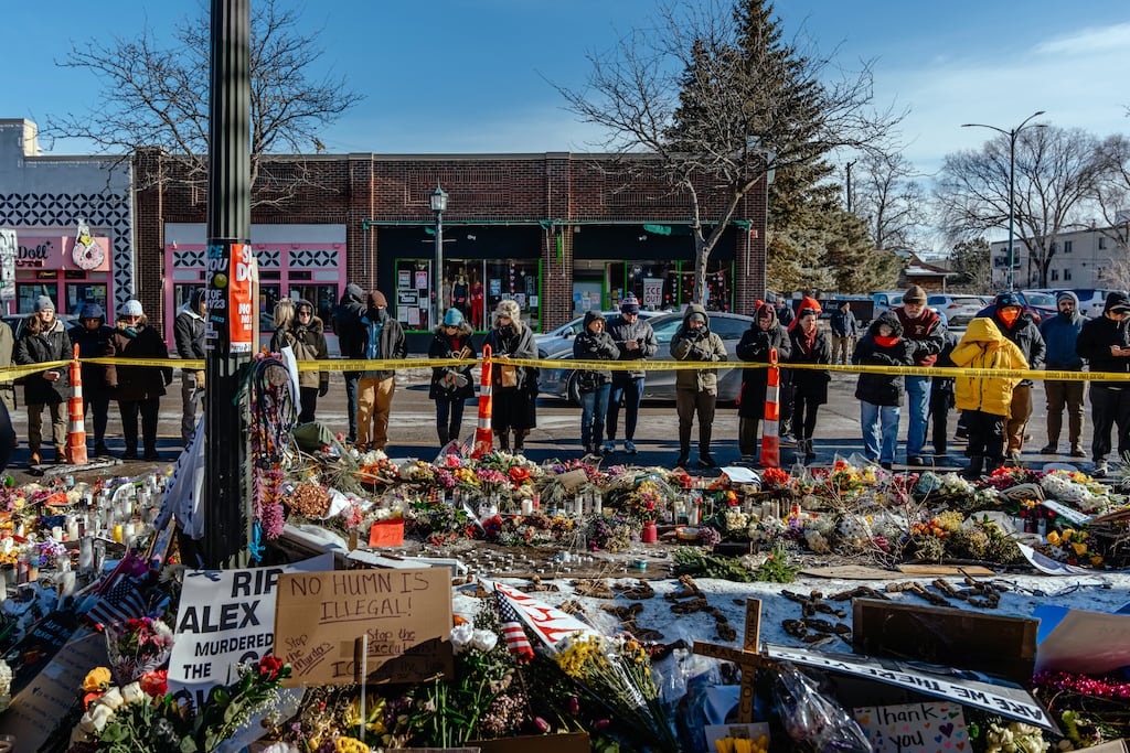 People gather at a memorial in Minneapolis for Alex Pretti, who was shot dead by Ice agents on Saturday. Photograph: Jamie Kelter Davis/New York Times
