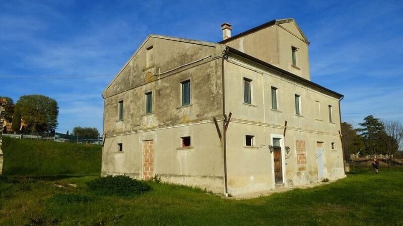 This 370sq m  house is in the countryside, 3km from Potenza Picena town.