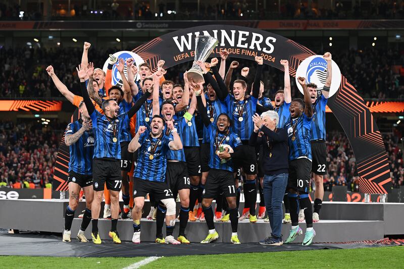 Berat Djimsiti of Atalanta BC lifts the Uefa Europa League Trophy with teammates after his team's victory. Photograph: Michael Regan/Getty