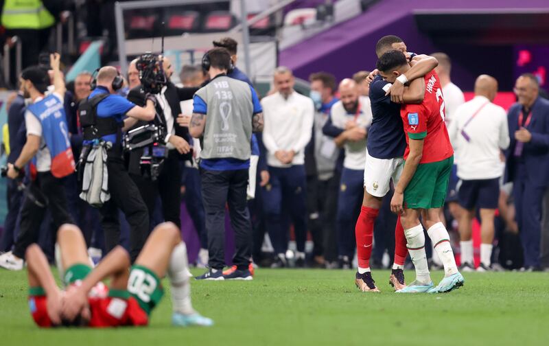Achraf Hakimi of Morocco embraces Kylian Mbappe of France after the semi-final at Al Bayt Stadium. Photograph: Getty Images
