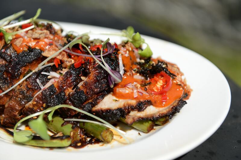 Ian Marconi’s Asian-style barbecued pork loin with Korean chilli seaweed sauce and charred greens. Photograph: Dara Mac Dónaill