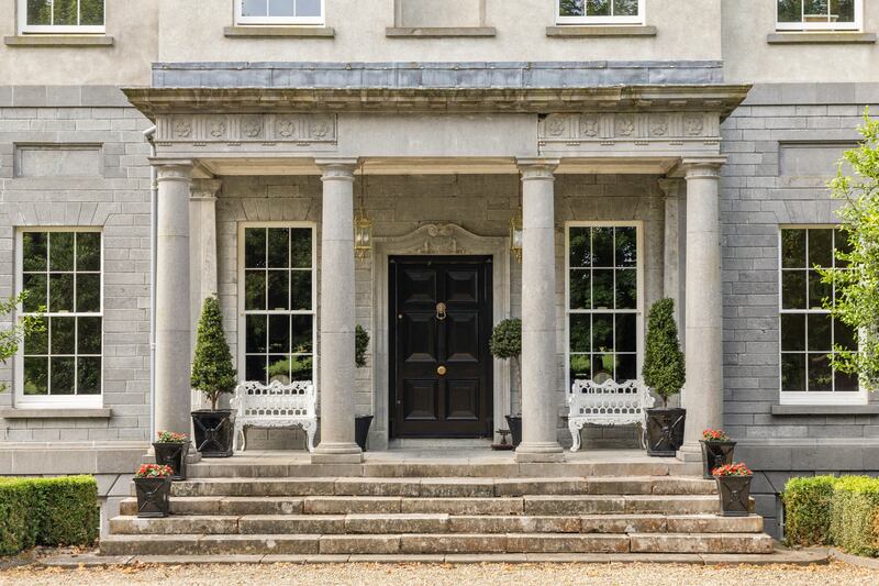 The entrance is a classical Doric portico