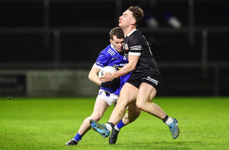 Scotstown's Darragh Murray comes up against Ceilum Doherty of Kilcoo. Photograph: Dan Clohessy/Inpho