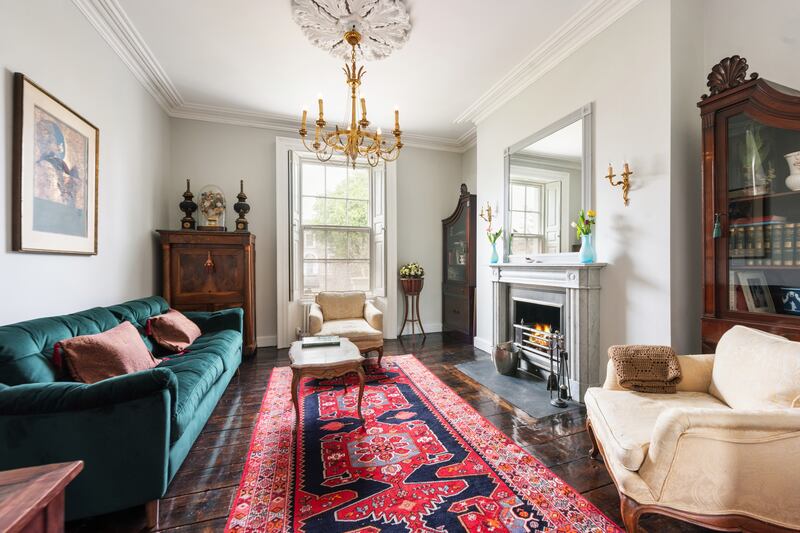 The drawing room has a lovely period fireplace