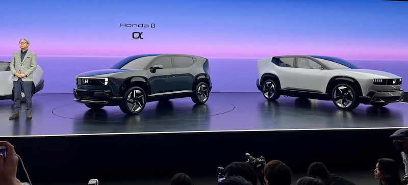 Honda CEO Toshihiro Mibe with the latest models for the 0 Series of EVs.