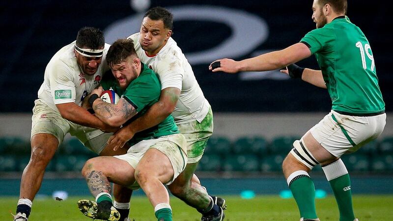 Ireland’s Andrew Porter is tackled by Mako Vunipola and Billy Vunipola of England. Photograph: Craig Mercer/Inpho