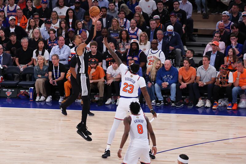Victor Wembanyama of the San Antonio Spurs shoots a three point basket. Photograph: Al Bello/Getty