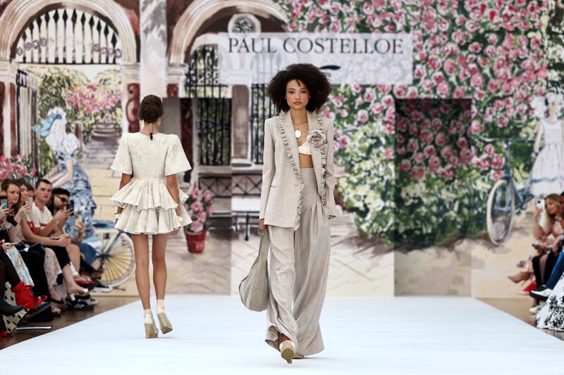 Models present creations by Irish designer Paul Costelloe during a catwalk presentation for his Spring/Summer 2024 collection. PhotographL henry Nicholls/AFP/Getty Images