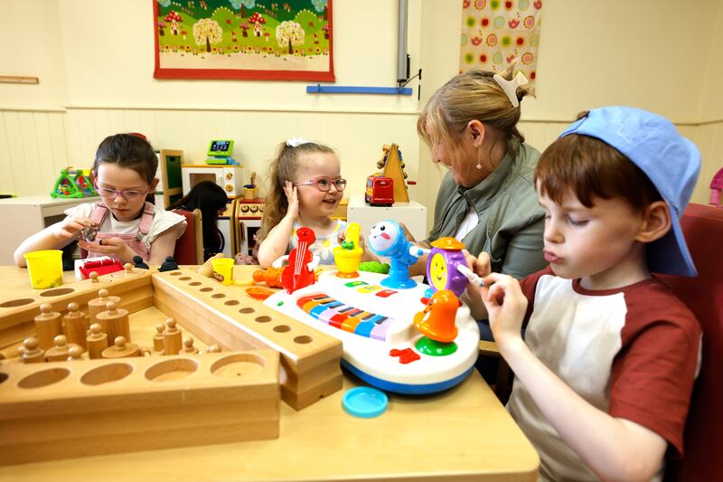 Trish Fitzpatrick, Early Years educator, with Cara, Selena and Leo at the Montessori. Photograph: Alan Betson
