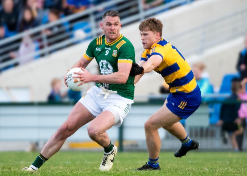 Meath’s Bryan Menton and Roscommon’s Pearse Frost. Photograph: Evan Logan/Inpho