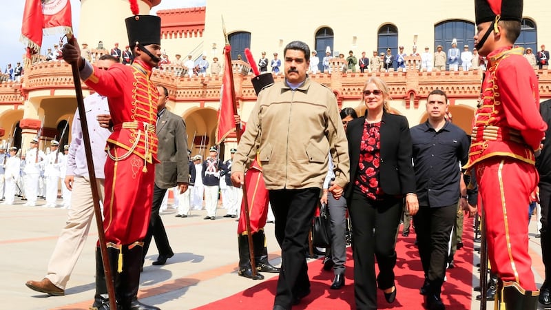 Venezuela’s President Nicolas Maduro  and first lady Cilia Flores during a military ceremony to commemorate the sixth anniversary of the death of President Hugo Chavez. Photograph: Venezuelan Presidency/AFP