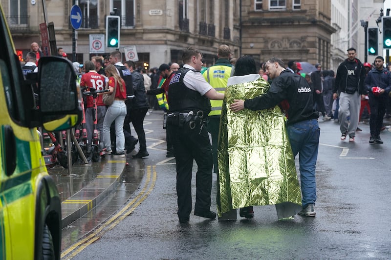 Liverpool parade ramming: Injured people are helped after the incident. Photograph: Owen Humphreys/PA