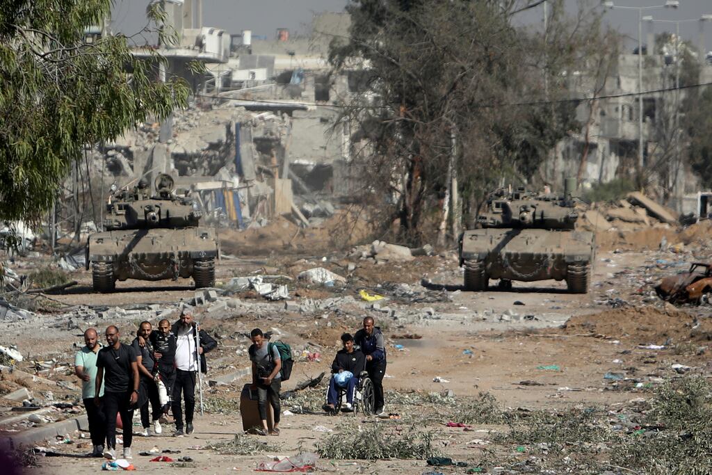 Palestinians flee from northern Gaza: Israel’s offensive has killed more than 34,000 Palestinians, say local health authorities. Entire families have been killed and swathes reduced to uninhabitable wastelands. Photograph: Mohammed Dahman/AP