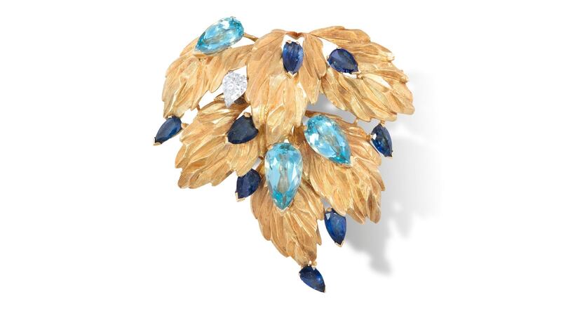 Lot 62, a  pear-shaped aquamarine, sapphire and diamond brooch by Andrew Grima