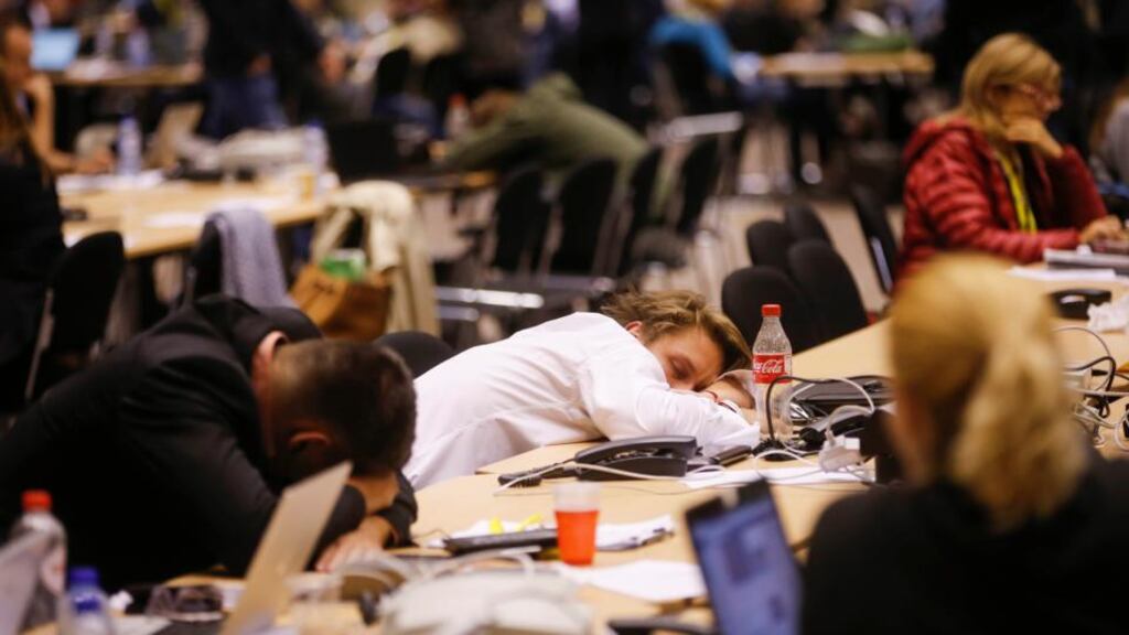 Journalists wait for the end of euro zone leader summit on the Greek crisis, at the European Council headquarters in Brussels. Photograph: EPA