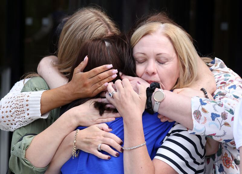 Karen Keely, co-founder of OACS Ireland and mother of three children suffering from the affects of Sodium Valproate, is hugged by Christina O'Callaghan and Beverly Dunne, OACS Ireland members. Photograph: Collins Keegan/Collins 