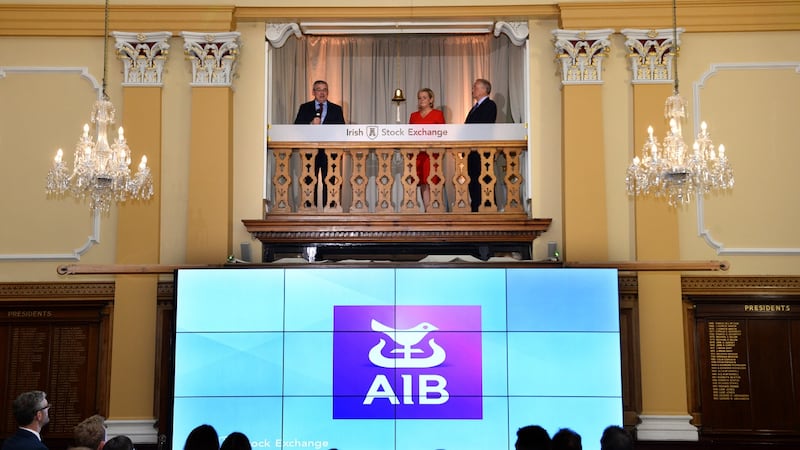AIB CEO Bernard Byrne  rings the bell at the Irish Stock Exchange with Irish Stock Exchange CEO Deirdre Somers,  and AIB chairman Richard Pym to mark the bank’s IPO. Photograph: Dara Mac Dónaill