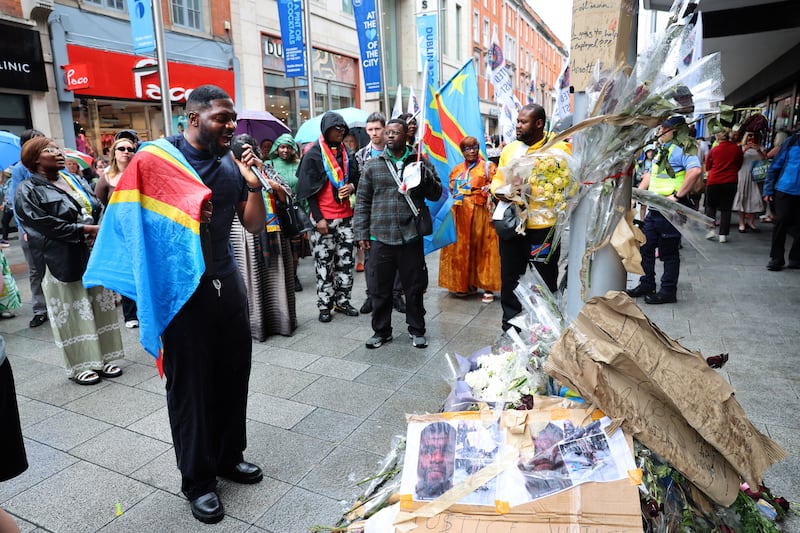 People gather at the spot where Yves Sakila died on Henry Street, Dublin, in May. Photograph: Dara Mac Dónaill
