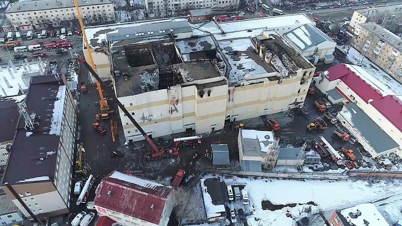 An aerial view of emergency services cleaning up the wreckage at the scene of the shopping centre fire in  Kemerovo. Photograph: Russian Ministry for Emergency Situations/AP